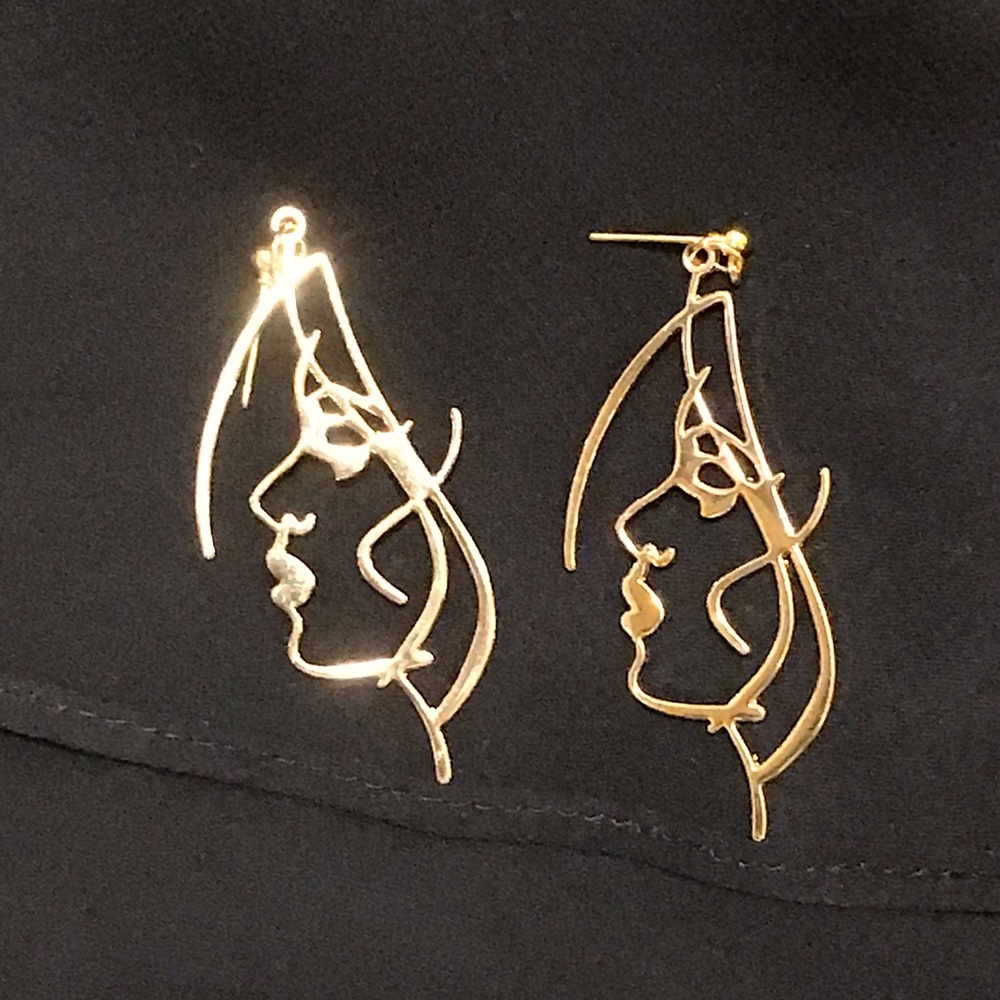 Sleek and sexy woman’s profile earrings.